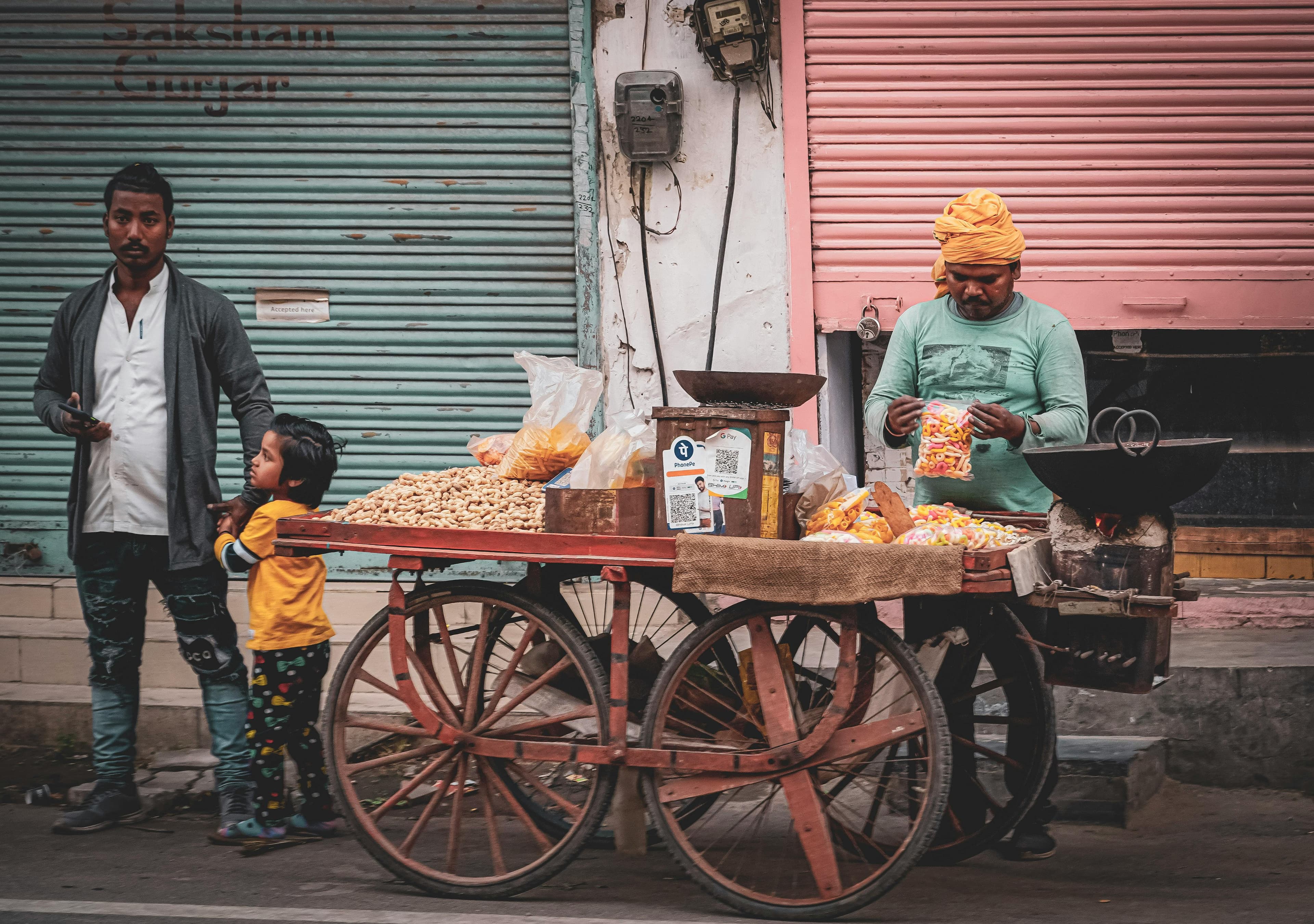 Karst mountain landscape in Guilin showing dramatic limestone peaks rising from green rice fields with the Li River winding through the valley under a misty morning sky